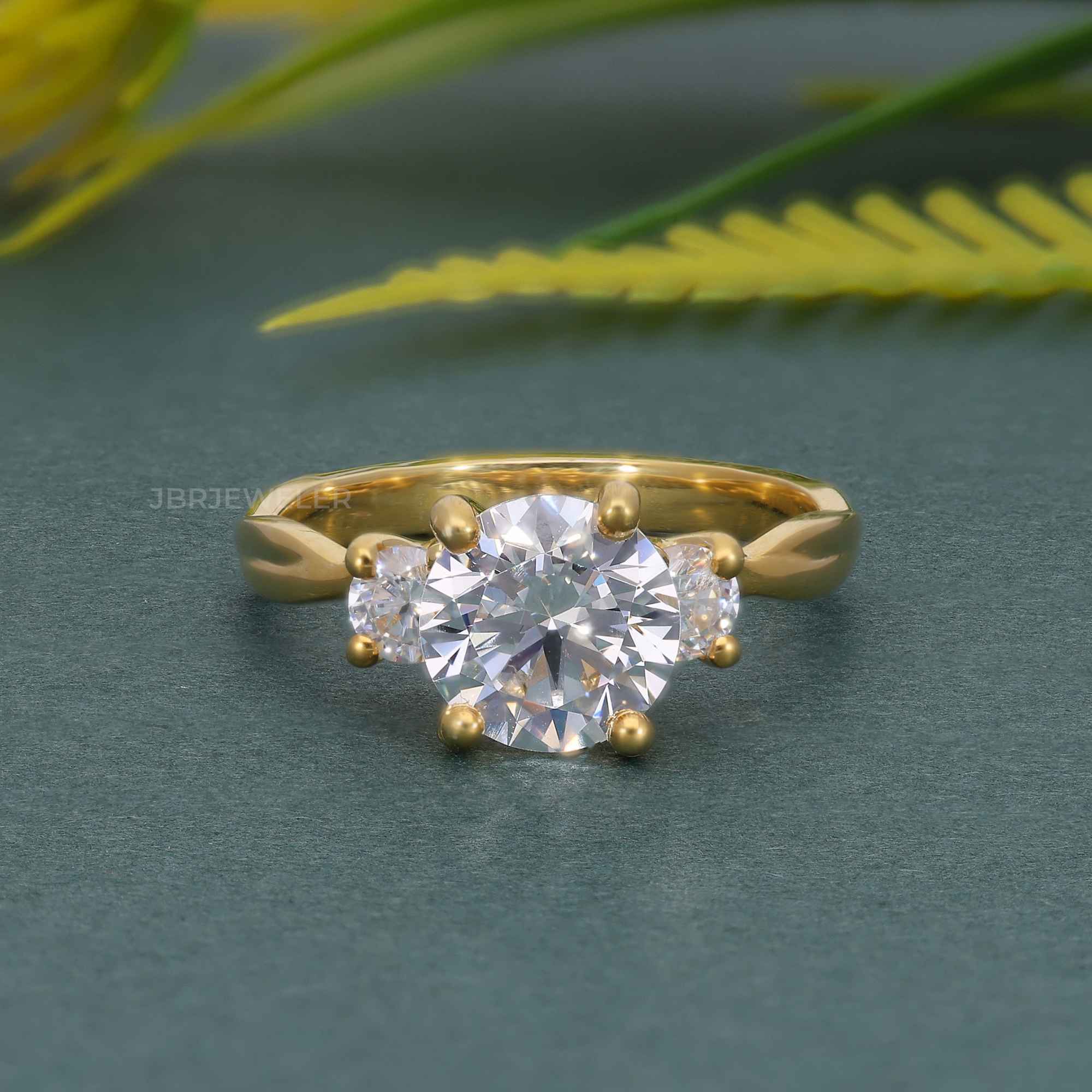a diamond ring on a green surface