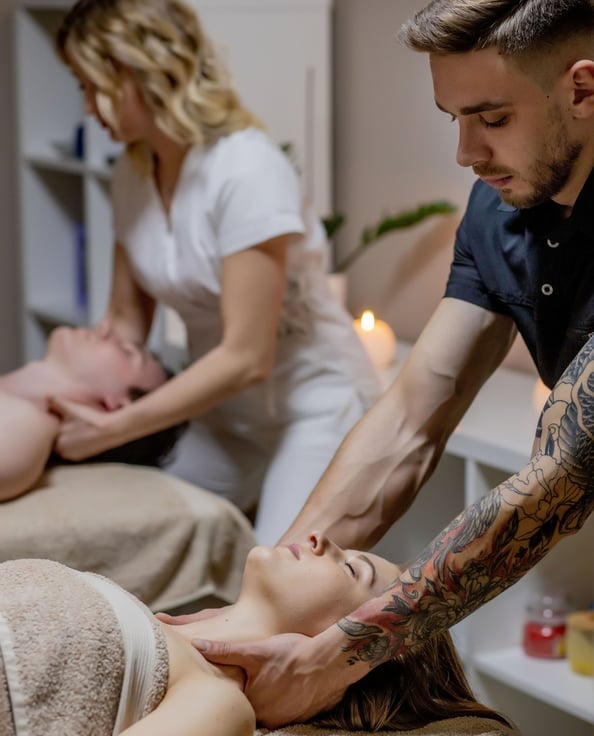 a man and woman getting a massage