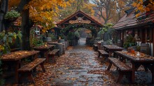 a path with benches and tables in front of a building