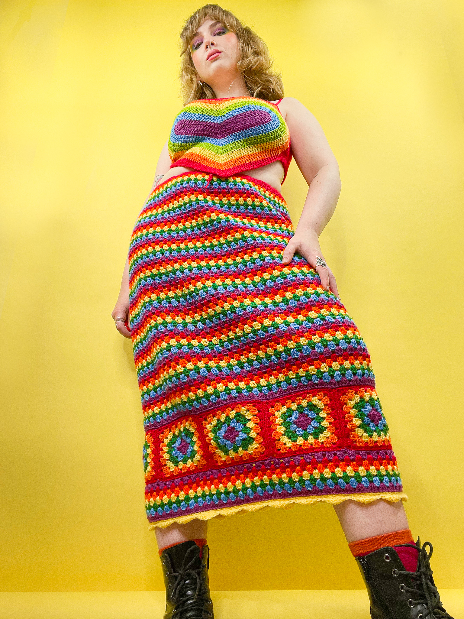 a woman in a rainbow colored dress
