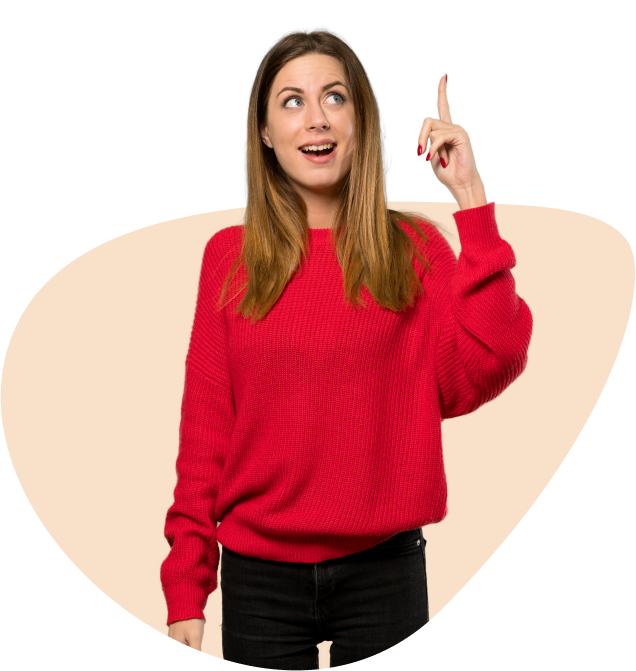 a woman in a red sweater pointing up