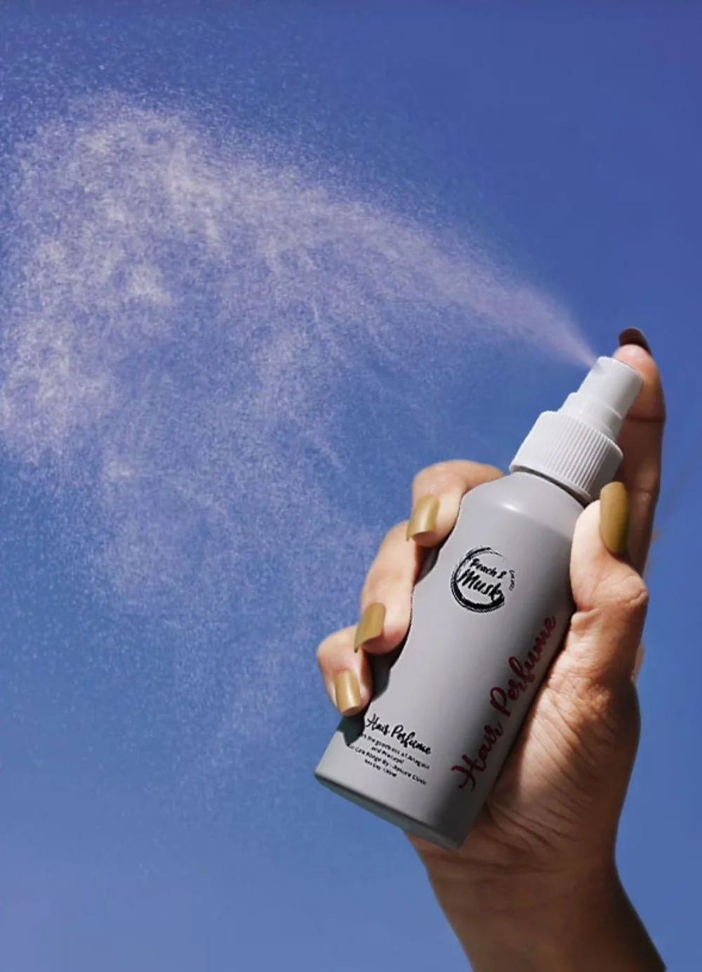 a person holding a spray bottle