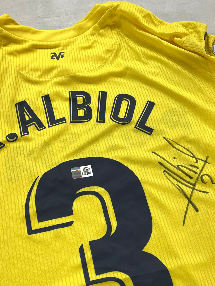 a yellow jersey with a number and a logo