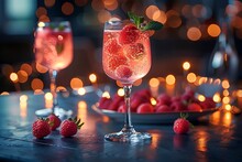 a glass of pink drink with strawberries and a plate of strawberries