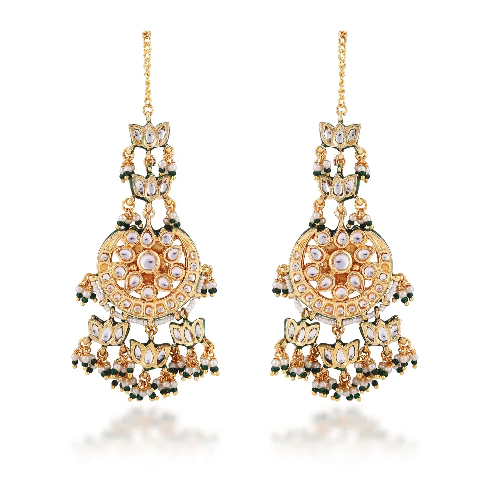 a pair of gold earrings with diamonds and green stones