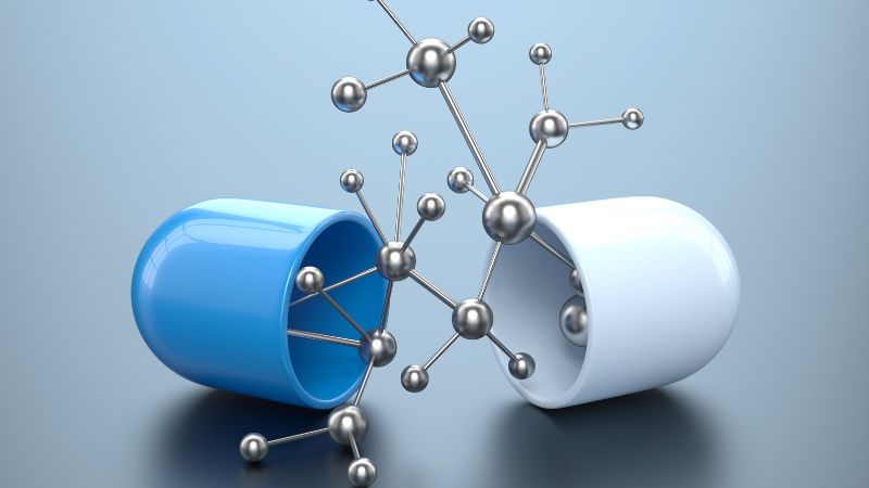 a blue and white capsules with connected molecules