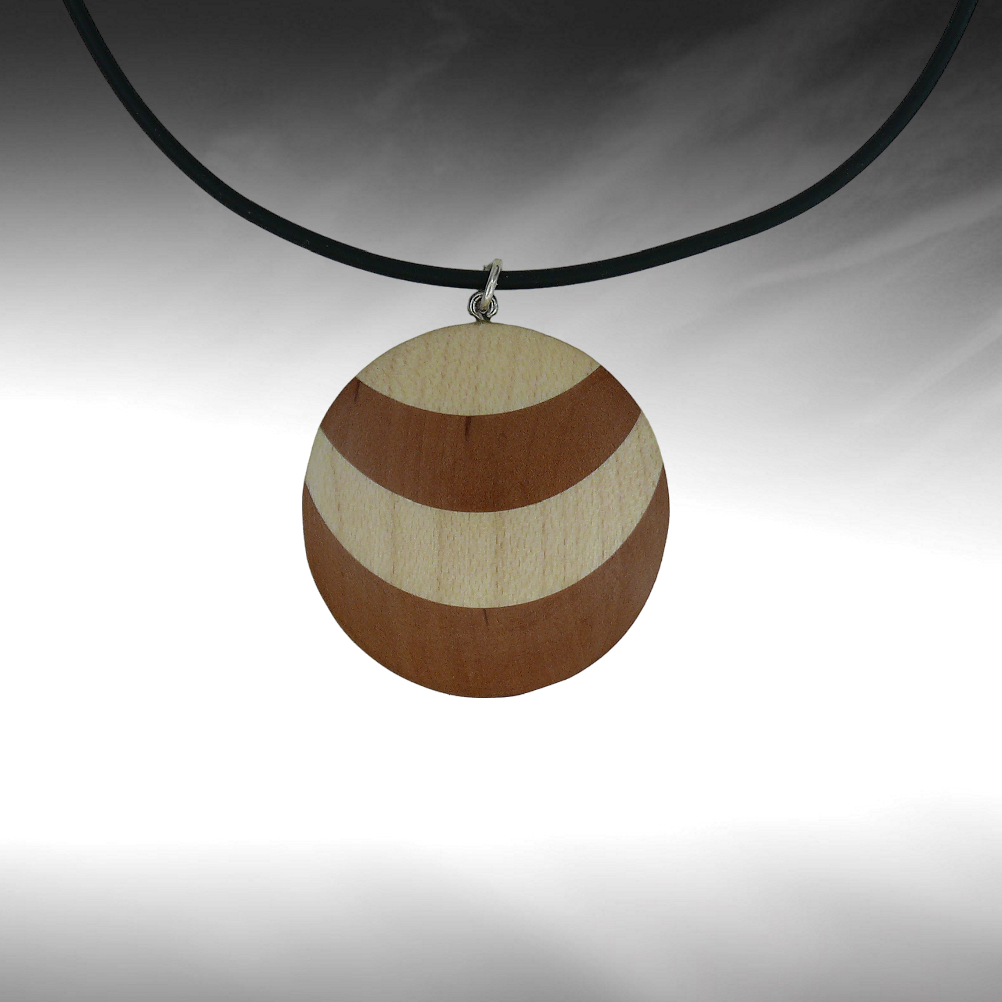 a necklace with a round wooden object