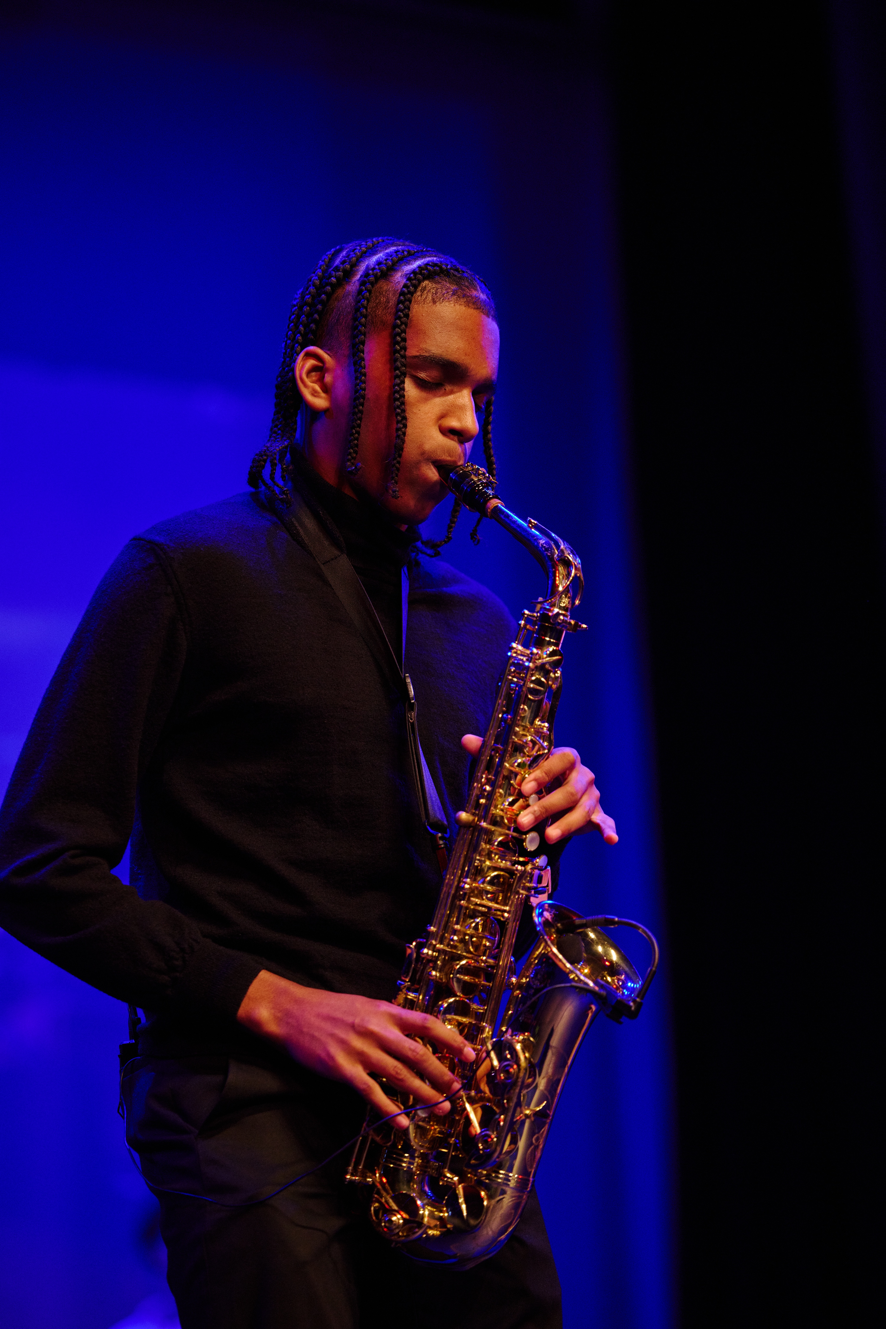 a man playing a saxophone