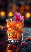 a glass with ice and a flower on top