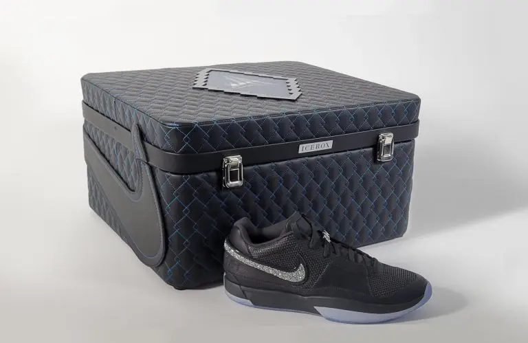 a black shoe next to a box