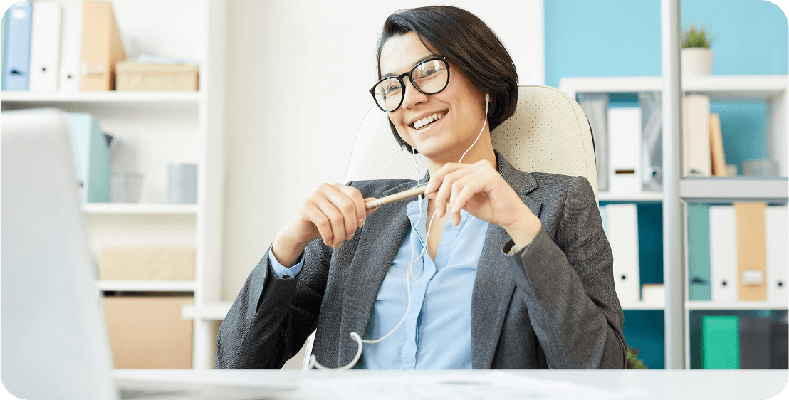 a woman sitting in a chair smiling