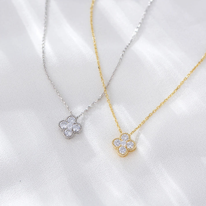 a group of necklaces with diamonds