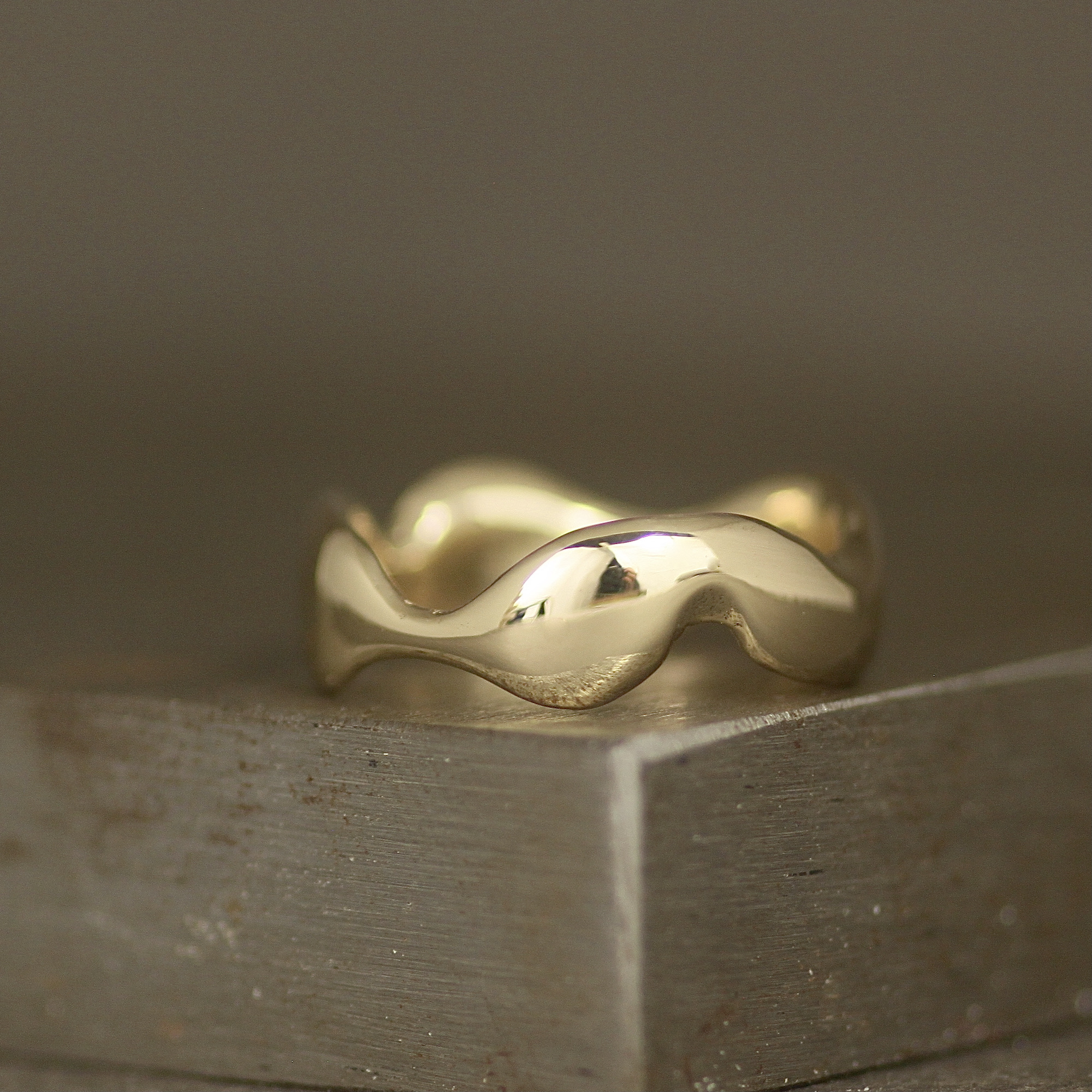 a gold ring on a metal surface