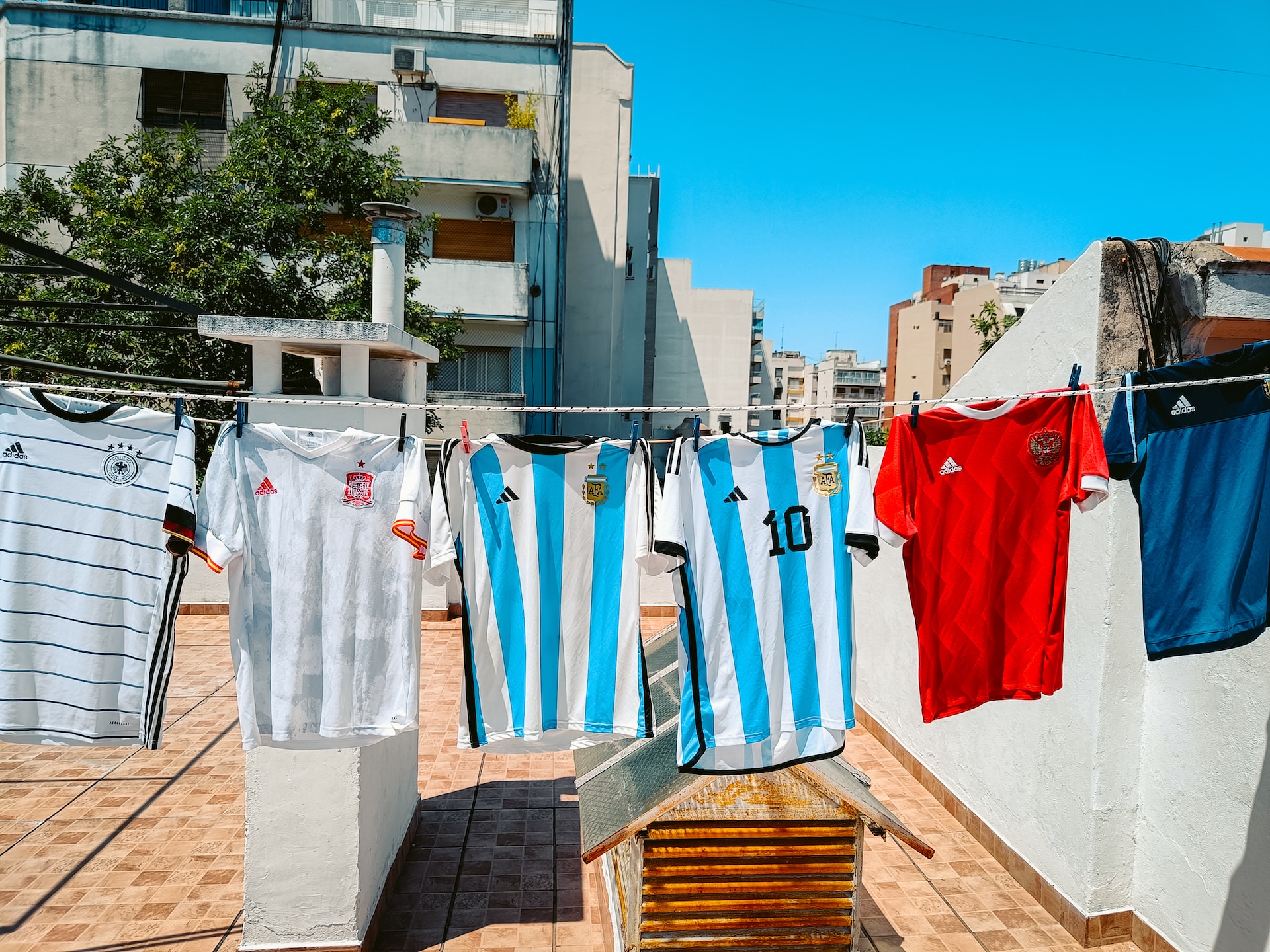 a group of shirts on a clothesline