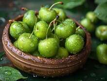 a bowl of green cherries