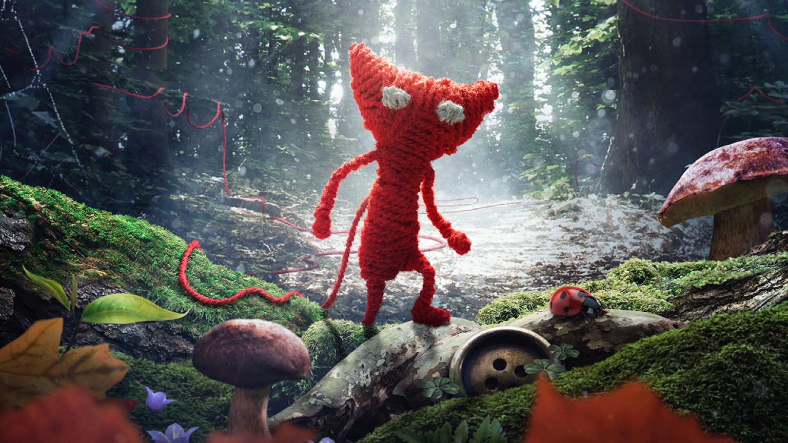 a red knitted doll in a forest