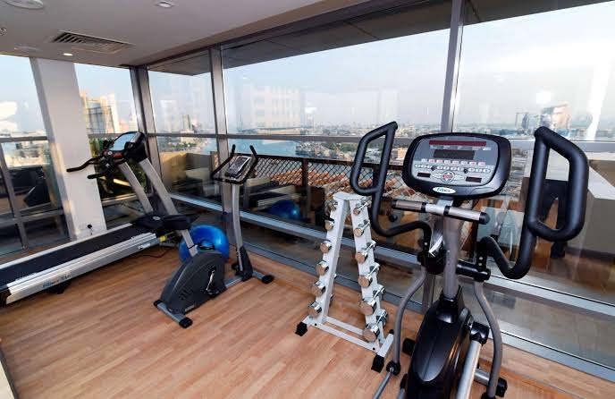 a room with exercise bikes and a window