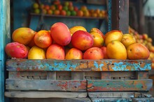 a group of mangoes in a wooden crate