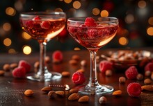 two glasses of wine with berries