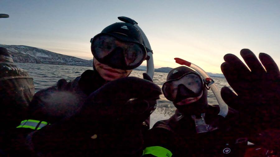 two people wearing scuba gear and goggles