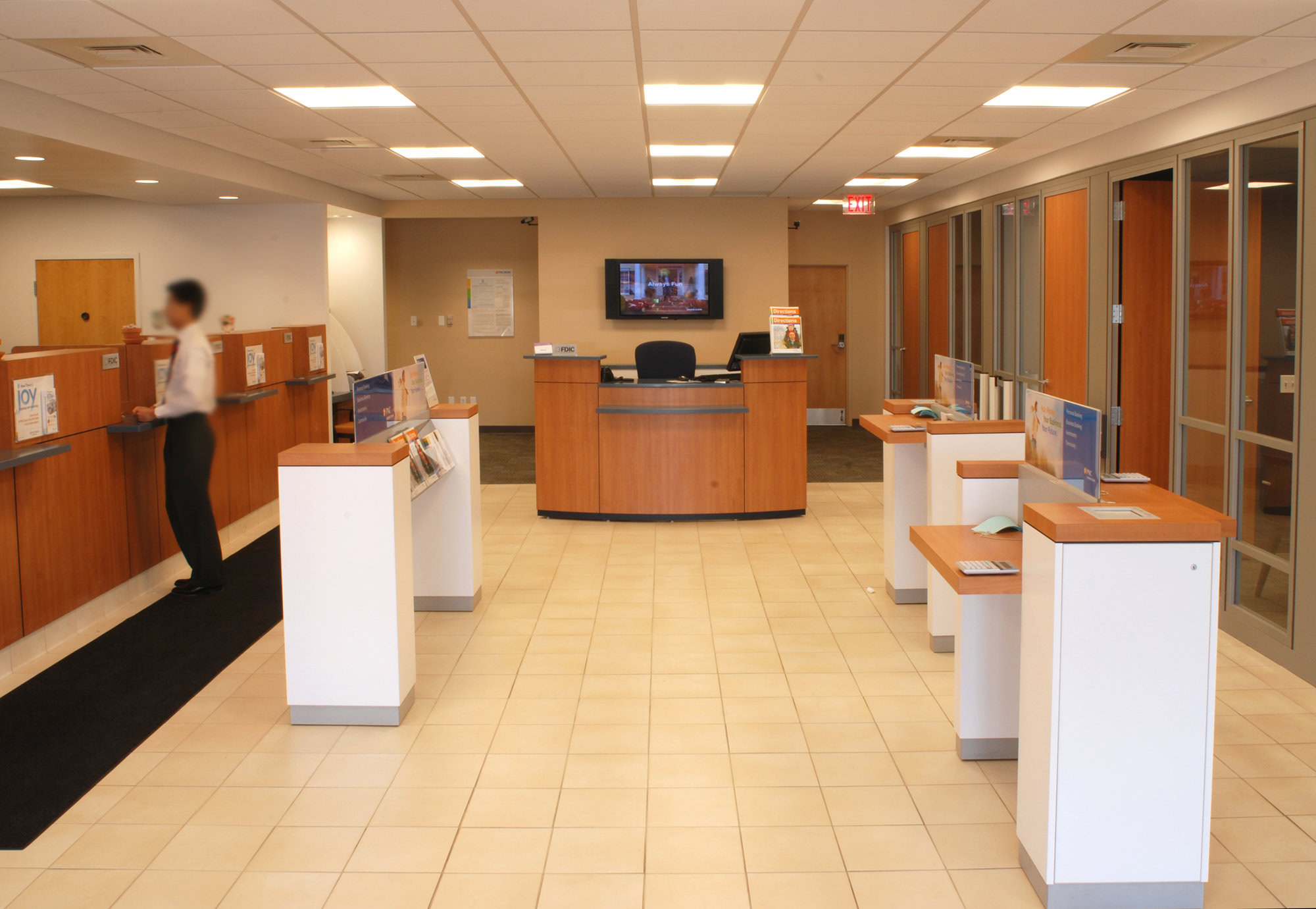 a person standing in front of a reception desk