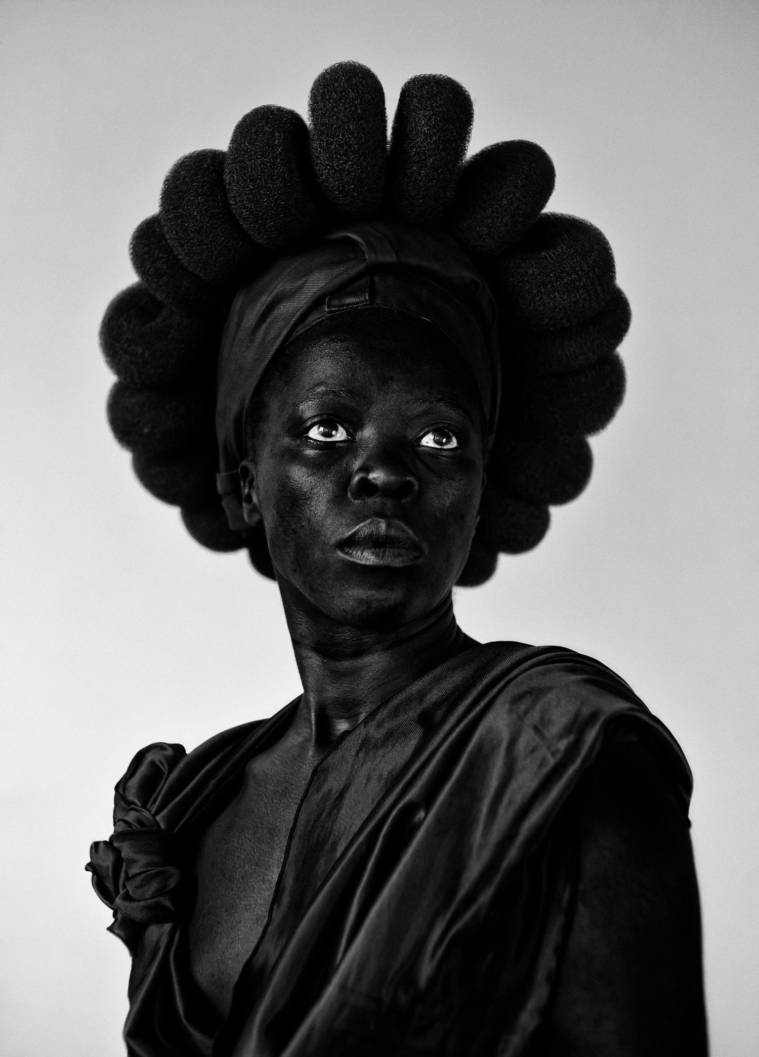 a person with a black headdress