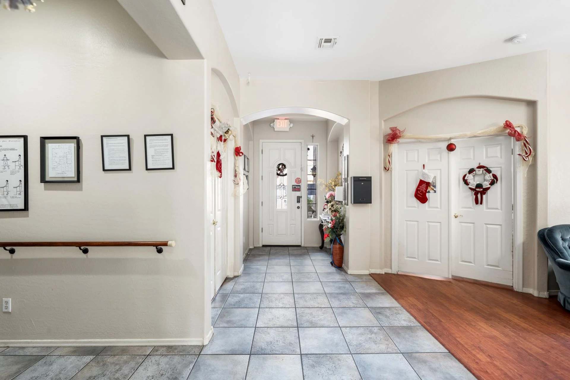 a hallway with white doors and decorations