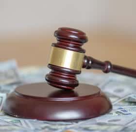 a gavel on top of money