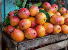 a pile of fruit on a wooden crate