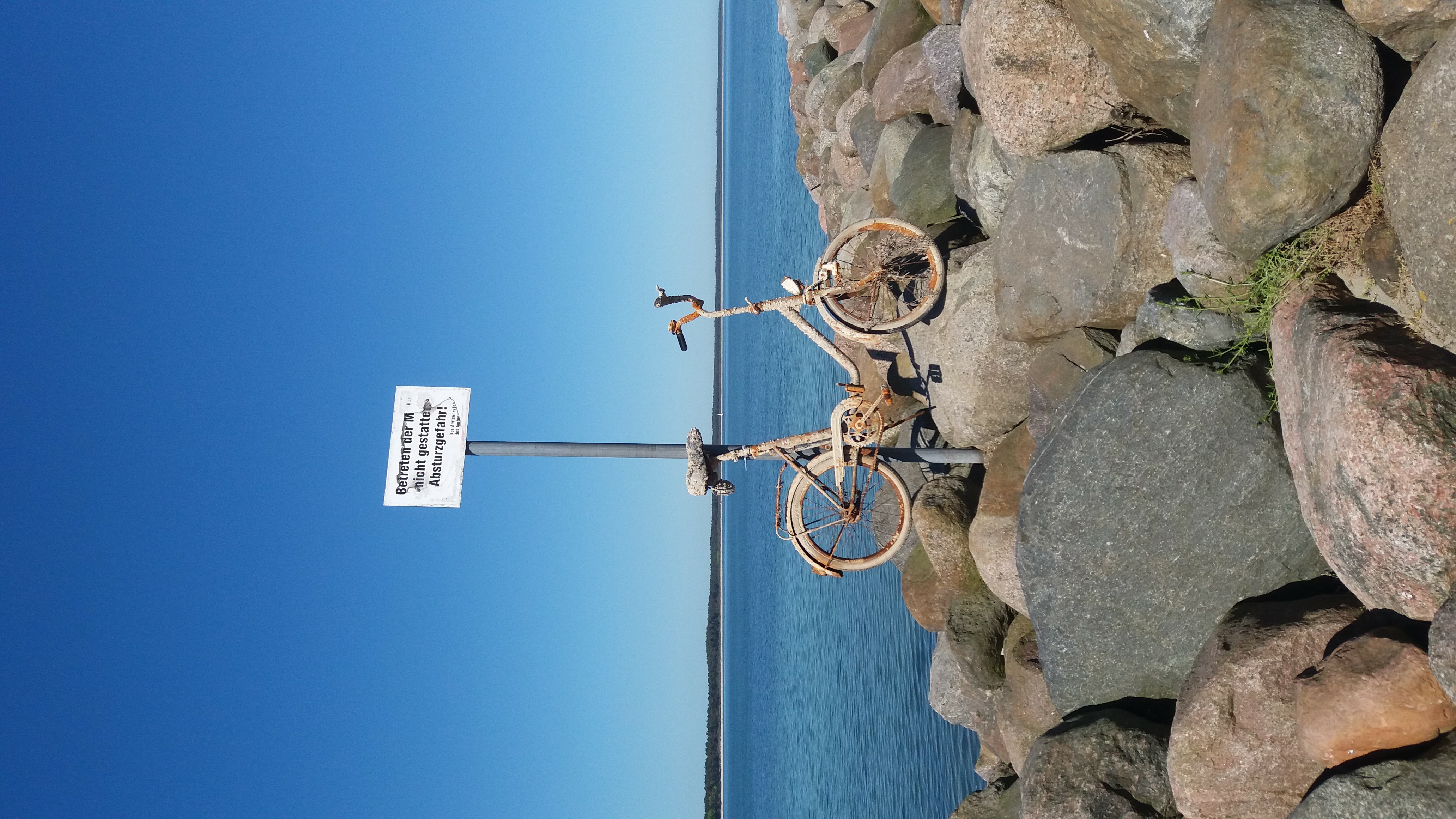 a bicycle on a rock wall