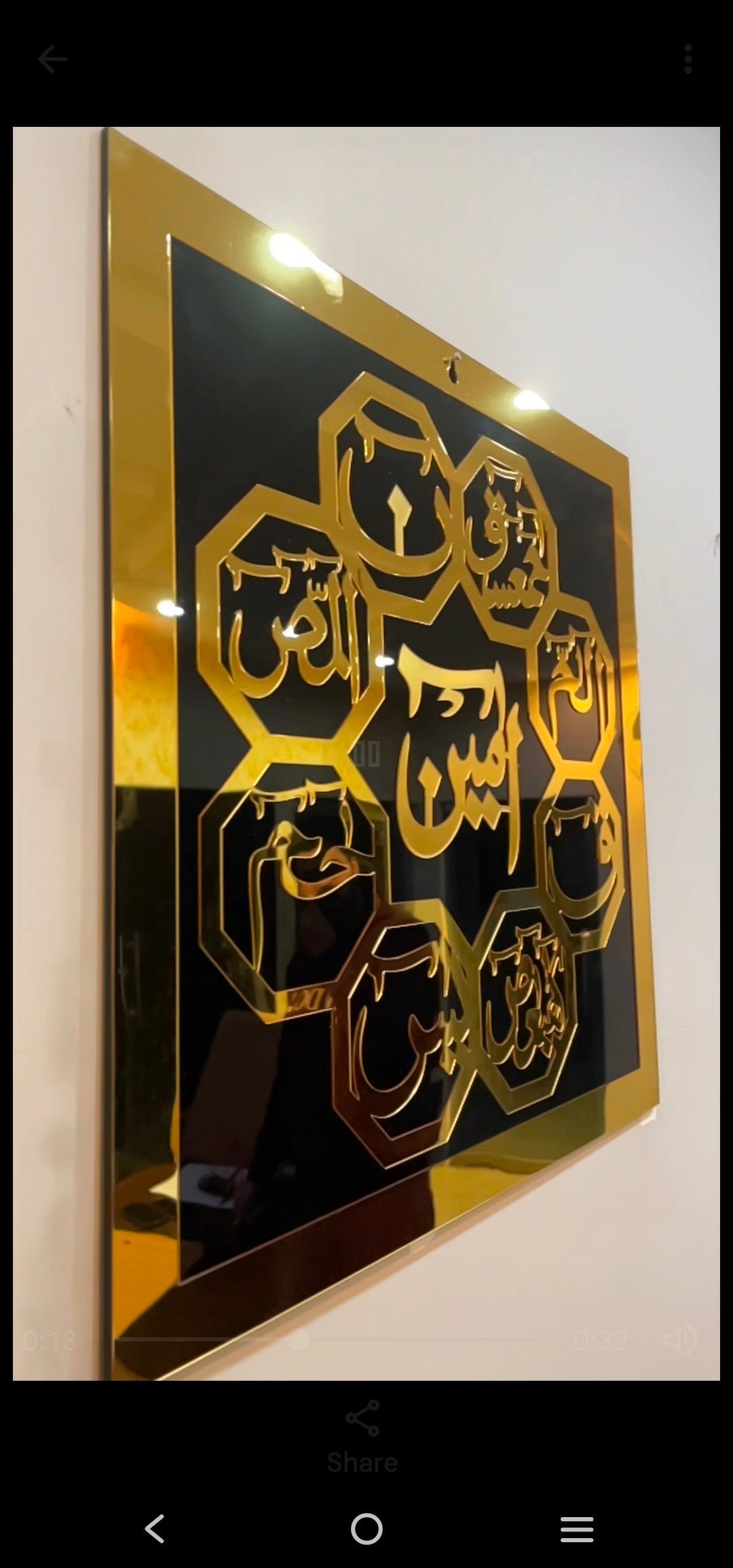 a black and gold framed art