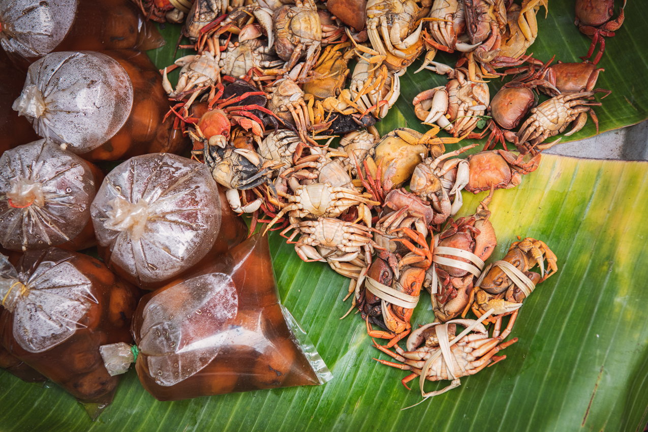 a group of crabs on a banana leaf
