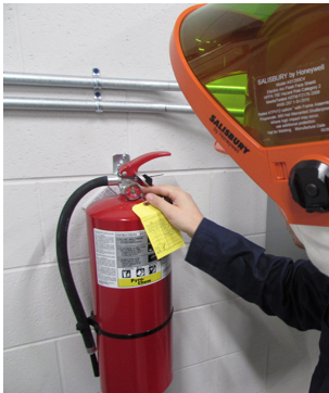 a person holding a fire extinguisher
