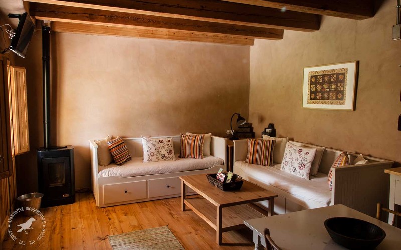 a living room with couches and coffee table