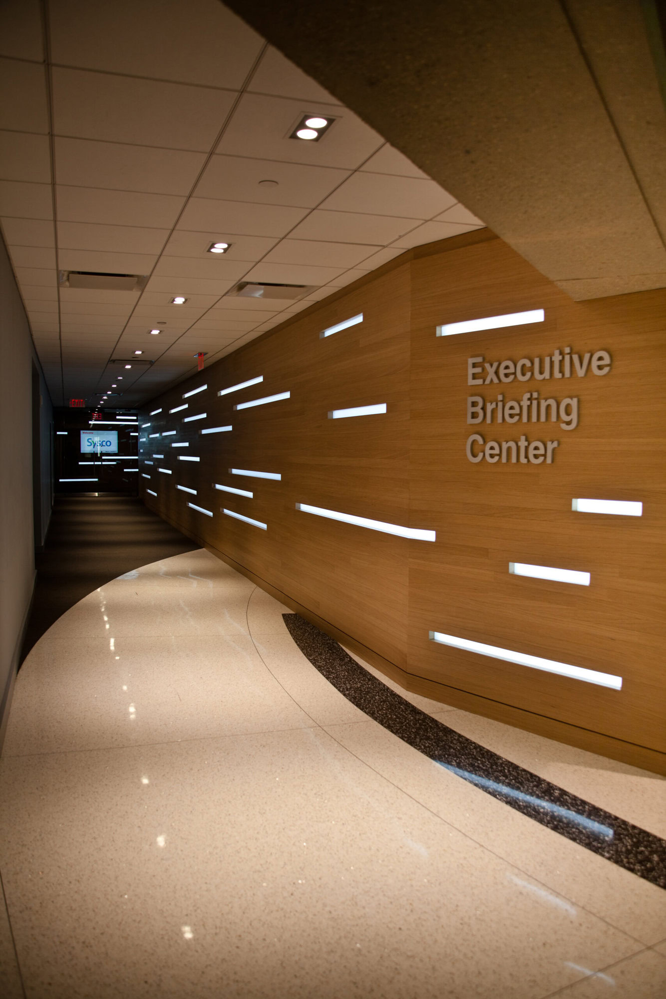 a hallway with white text on the wall