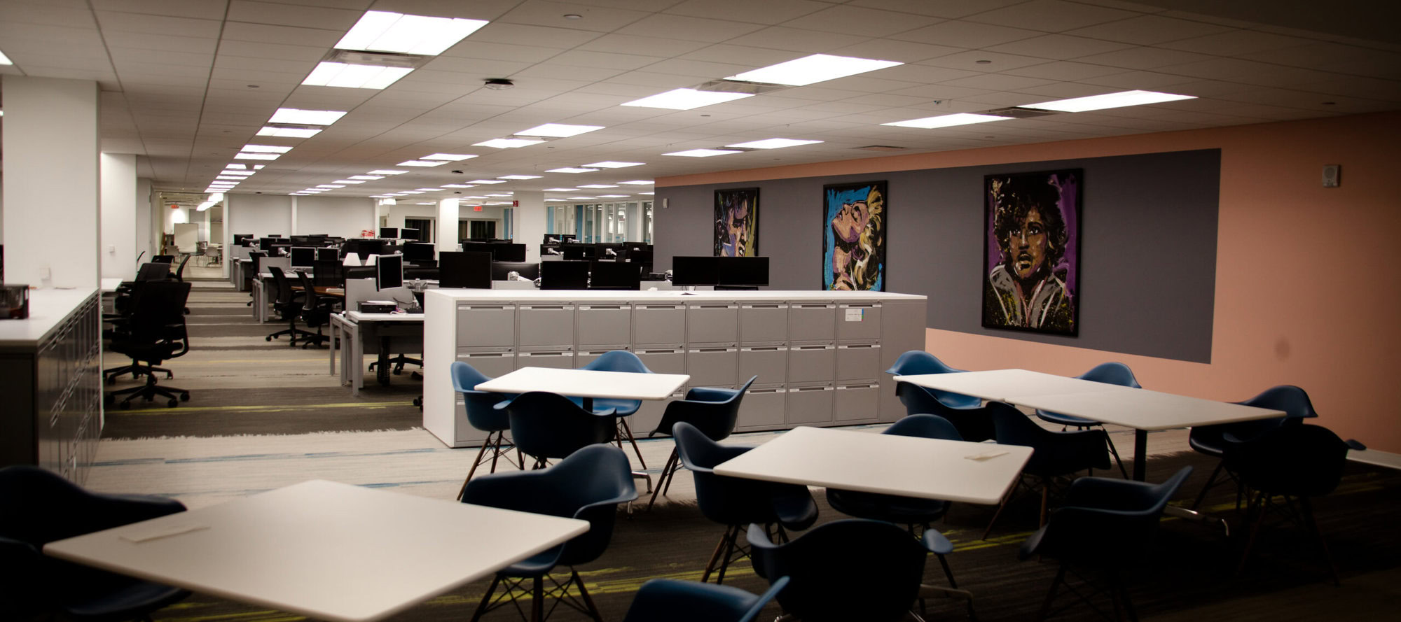 an office with tables and chairs