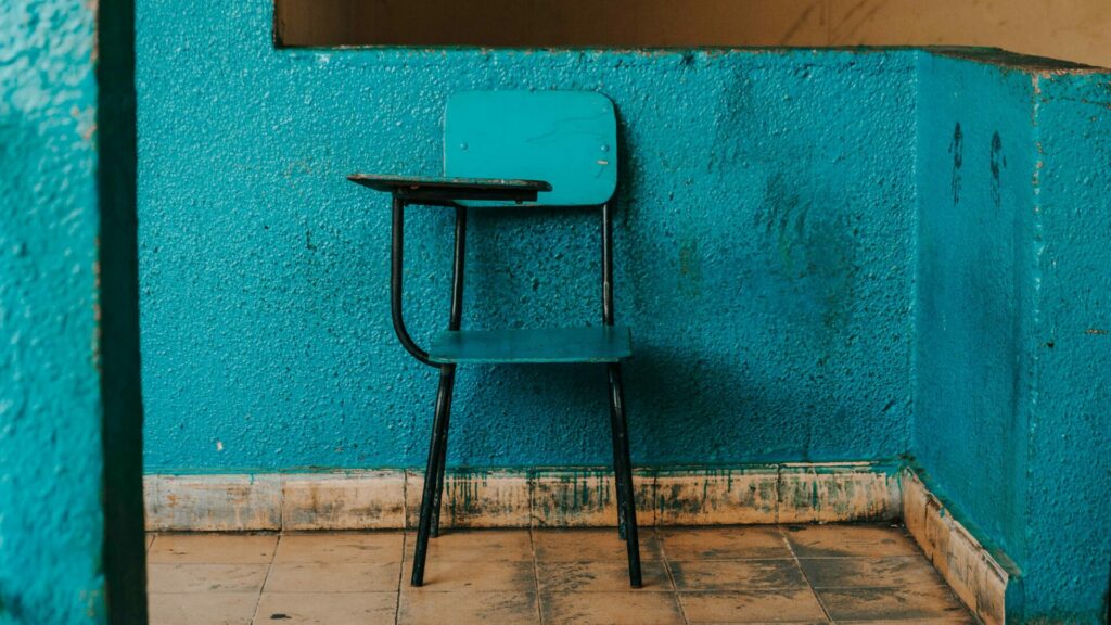 a blue chair against a blue wall