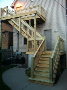 a wooden staircase outside of a house