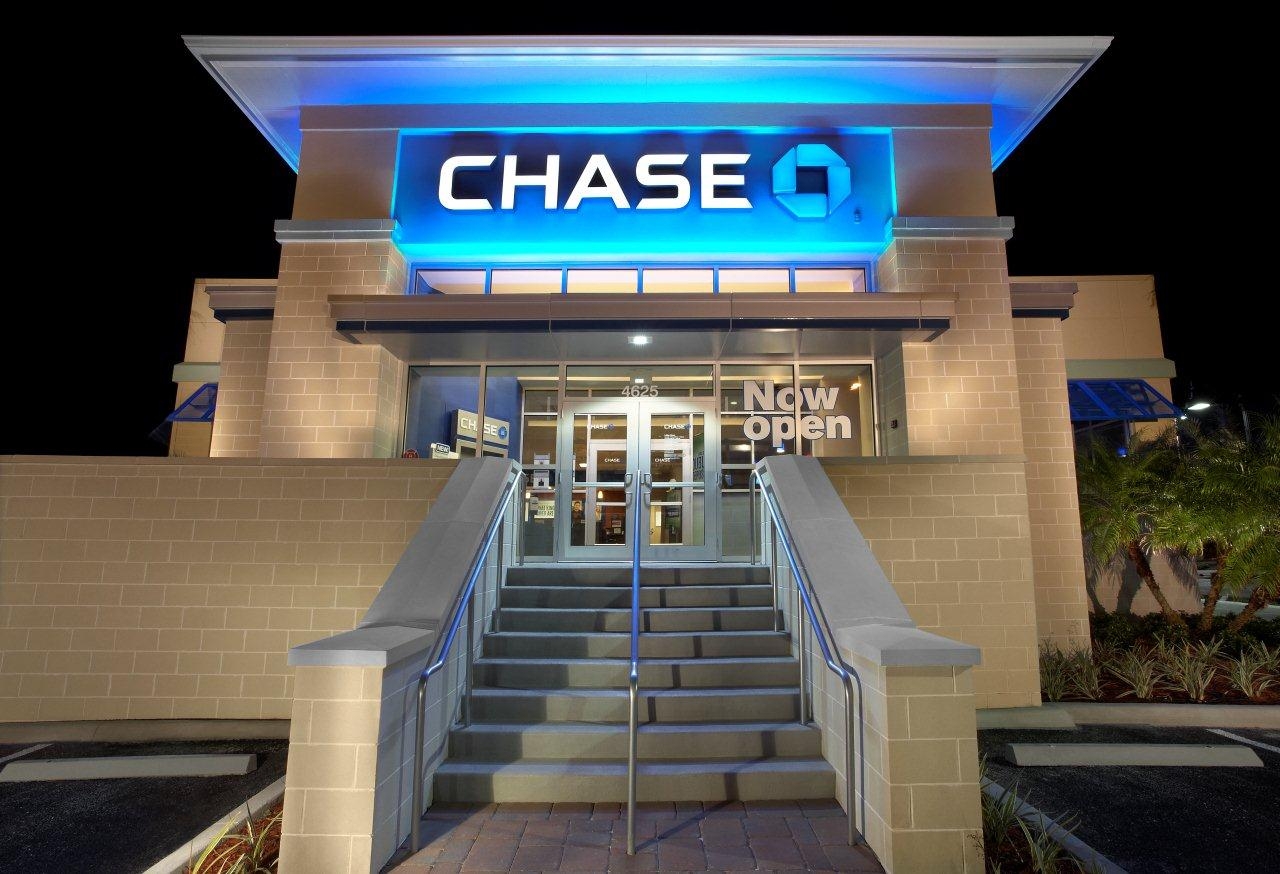 a bank building with a blue sign