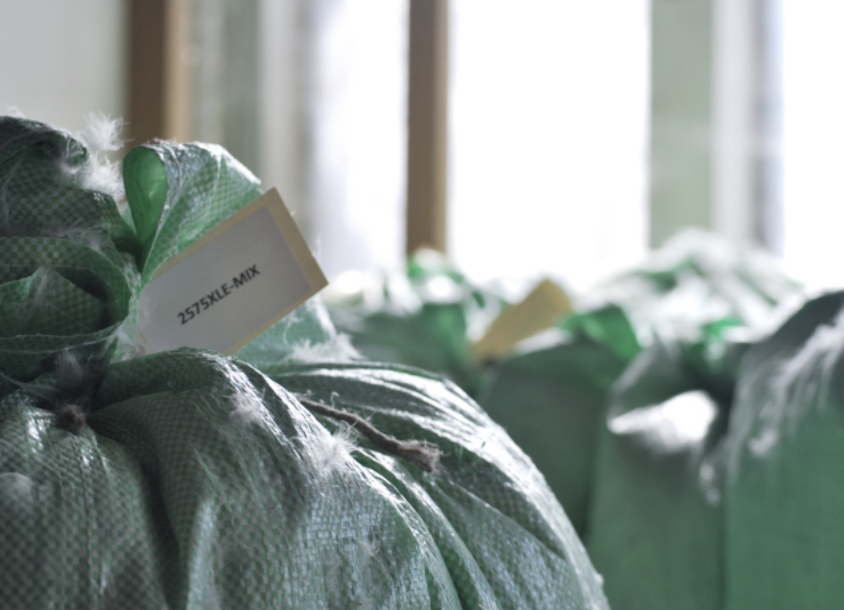 a bag of green bags with a tag