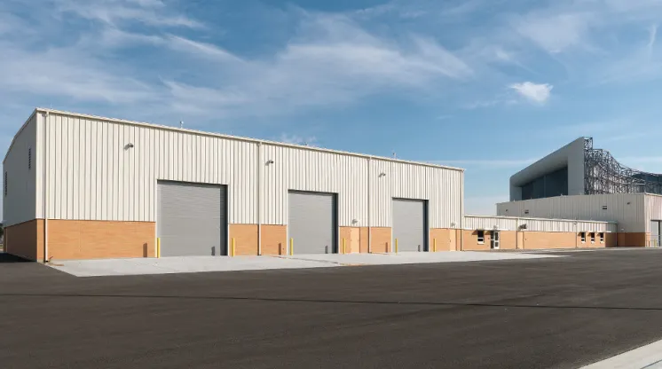 a building with doors and a parking lot