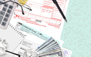 a tax form with money and glasses