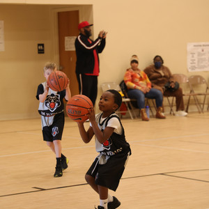 a boy holding a basketball