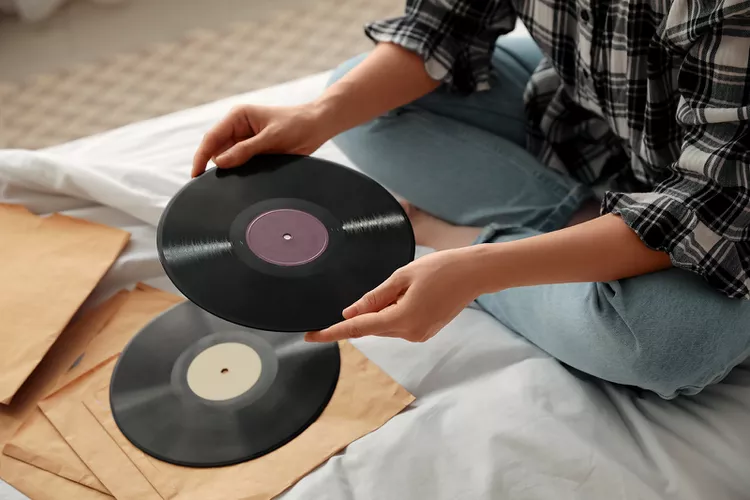 a person holding a record