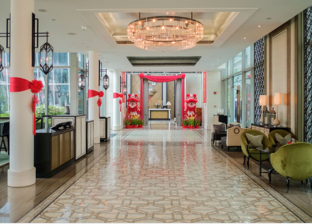 a lobby with a chandelier and a large chandelier