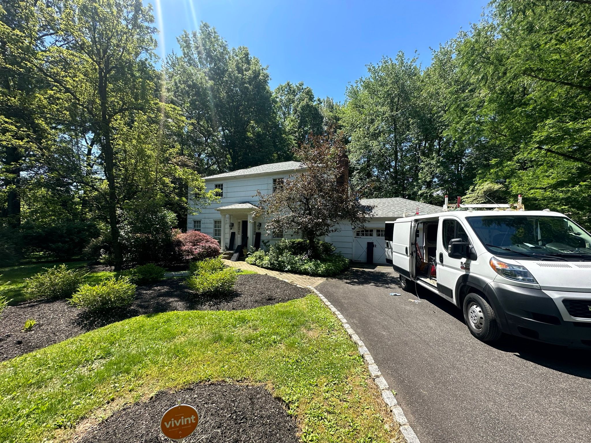 a van parked in front of a house