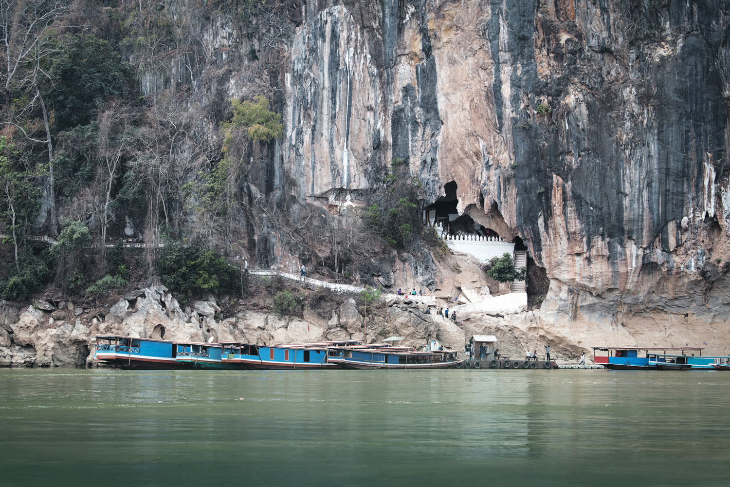 boats on the side of a cliff