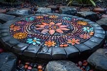 a circular stone with colorful flowers on it