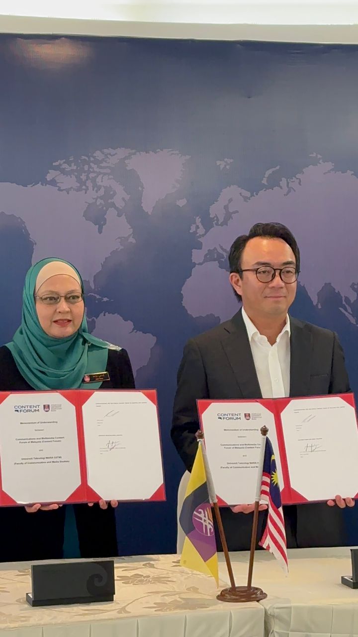 a man and woman holding certificates