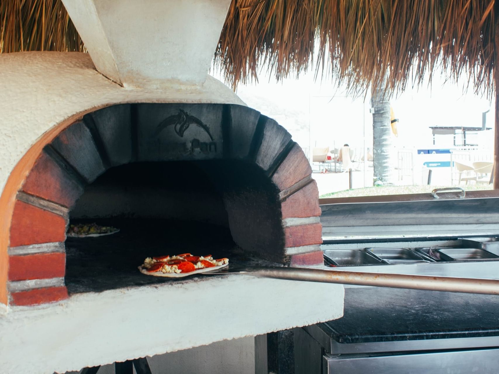 pizza pizzas cooking in a brick oven